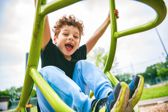 Happy kid on playground on summer season