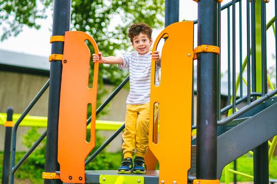 Happy kid on playground on summer season