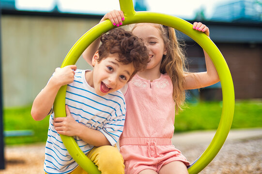 Happy kids on playground in summer season