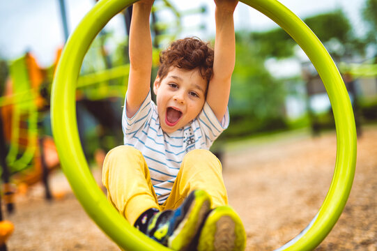 Happy kid on playground on summer season