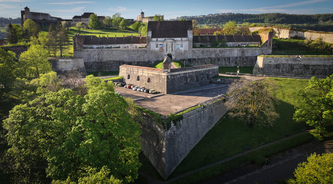 Aerial view of Besancon Citadel with its massive stone fortifications, green ramparts, and surrounding trees in Besancon, Bourgogne-Franche-Com, France.
