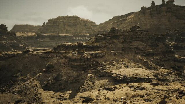 Moody badlands expanse with layered rock shelves and muted sky, dramatic textures and deep shadow pockets, ideal for documentary, geological survey,
