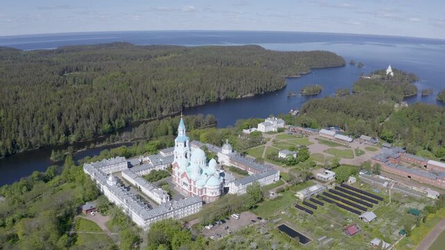 Forward reveal aerial footage of Valaam Monastery and Ladoga lake on sunny summer day. Karelia, Russia.