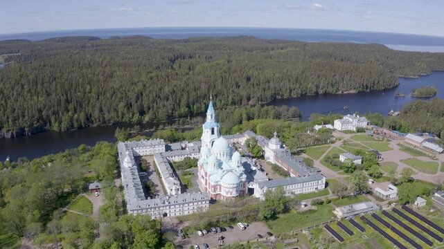 Panoramic aerial footage of Valaam Monastery and Ladoga lake on sunny summer day. Karelia, Russia.
