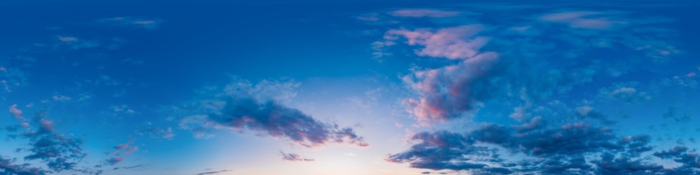 Sky clouds panorama showing sunset with pink clouds in 360 degree equirectangular format for environment mapping and vr