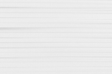 Fototapeta premium Abstract white background with fine horizontal lines and grain