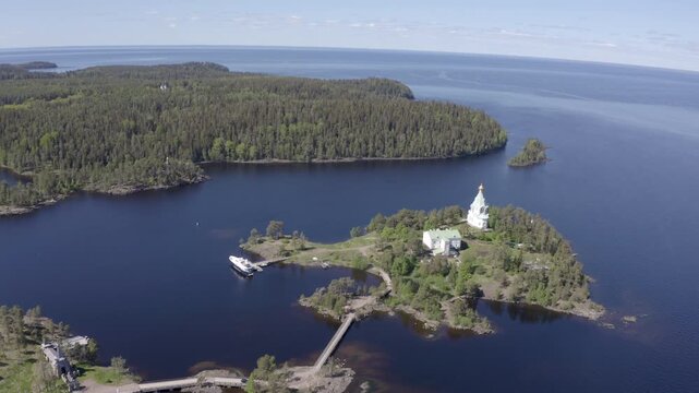 Aerial footage of St. Nicholas Skete of Valaam Monastery on sunny summer day. Ladoga lake, Karelia, Russia.