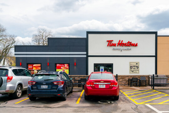 Rochester, NY - Apr 14, 2026: Exterior of the Tim Hortons coffee and bakery shop providing beverages, baked goods, and quick‑service dining located at 1290 University Avenue, Rochester, NY 14607