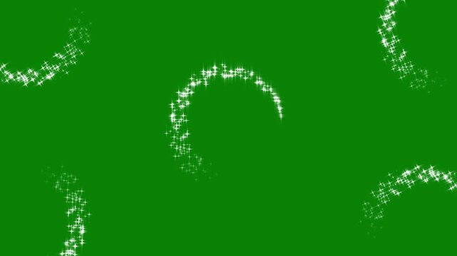Glimmering magic stars dust rotation over green screen surface keyable loop animation for fantasy movie transitions post production editing and VFX video overlay.