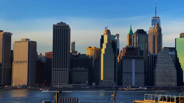 Financial District at the southern tip of Lower Manhattan at sunset time. Towers of the East River waterfront, historic and economic heart of New York City.