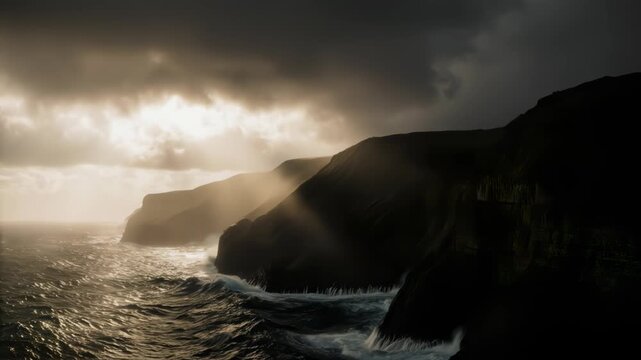 Slow tracking shot of sea cliffs with waves crashing under dramatic sun rays and cloudy sky
