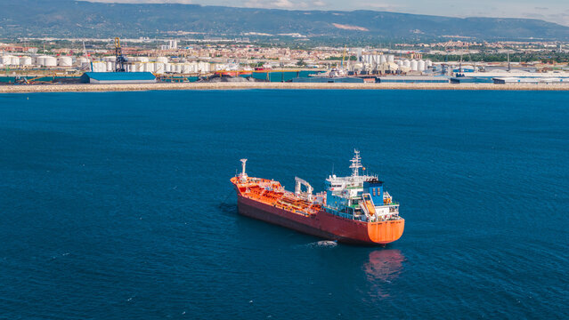 Aerial view of chemical tanker ship near industrial port coastline in Tarragona Spain