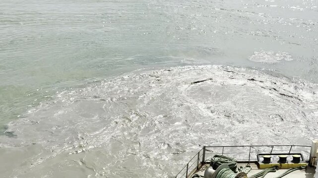 ship start running propeller at small depth and lift the clay  from bottom. make a dirty water seethe