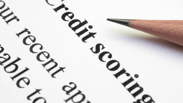 Credit Scoring Concept with Pencil Pointing at Financial Document