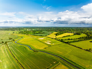 Obraz premium Fields and farms over Bodiam Castle, Bodiam, Robertsbridge, East Sussex, England