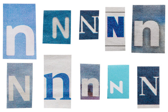 Set of blue ransom letters N cut out from vintage newspapers and magazines isolated for collage