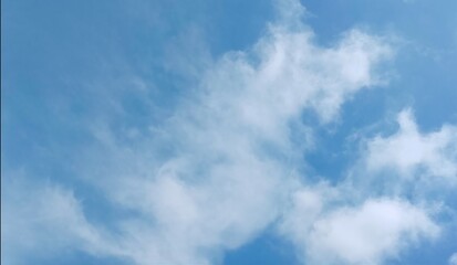 Fototapeta premium Blue sky with soft white clouds background
