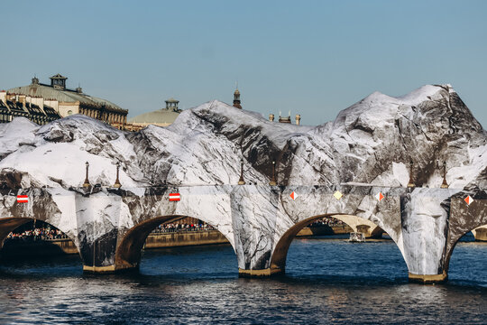 Paris, France - May 21, 2026: The historic Pont Neuf bridge transformed by French artist JR into a monumental cave-inspired temporary public art installation