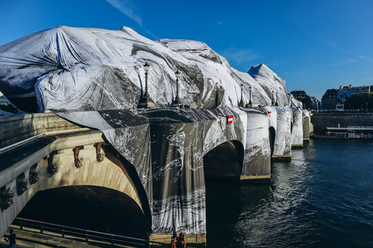 Paris, France - May 21, 2026: The historic Pont Neuf bridge transformed by French artist JR into a monumental cave-inspired temporary public art installation