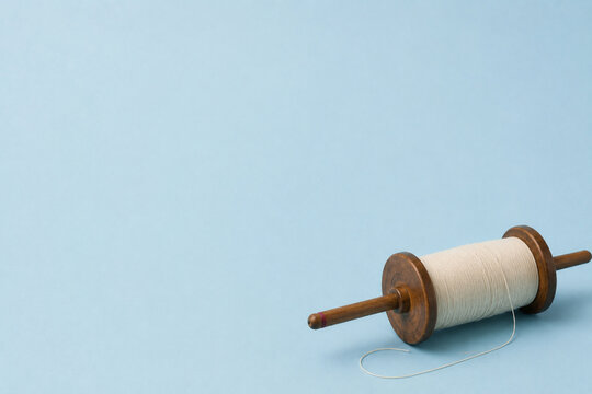 Minimal kite spool scene with airy seasonal mood and spacious copy space