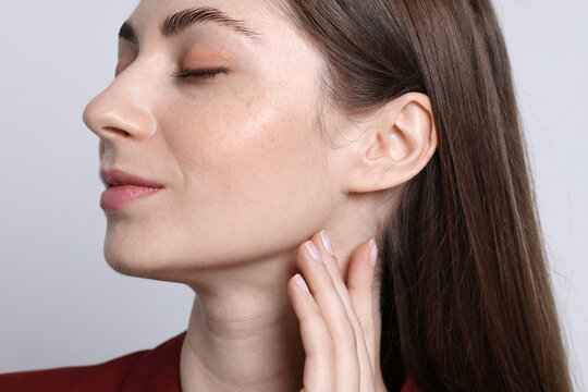 Woman with normal skin on light background