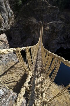 Last intact Inca rope bridge made of braided Peruvian feathergrass (Jarava ichu), across River Apurimac, Peru