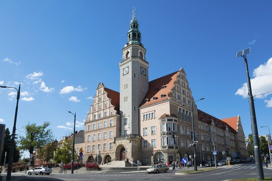 A historic town hall with tower and clock, surrounded by a lively street scene, Town Hall, Olsztyn, Alleinstein, Warmia-Masuria, Poland