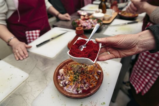 Red spice mix in a bowl, cooking class, cooking together, tajine, Moroccan speciality, Marrakech, Morocco