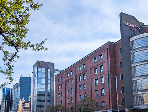 Belfast, UK, April 21, 2026. The street view of Leonardo Hotel Belfast on Great Victoria Street, with The Fitzwilliam Hotel Belfast and Europa Hotel at background