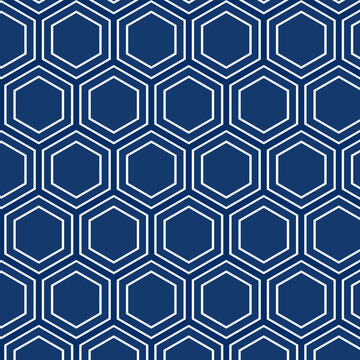 Seamless geometric pattern of white hexagonal shapes on a dark blue background