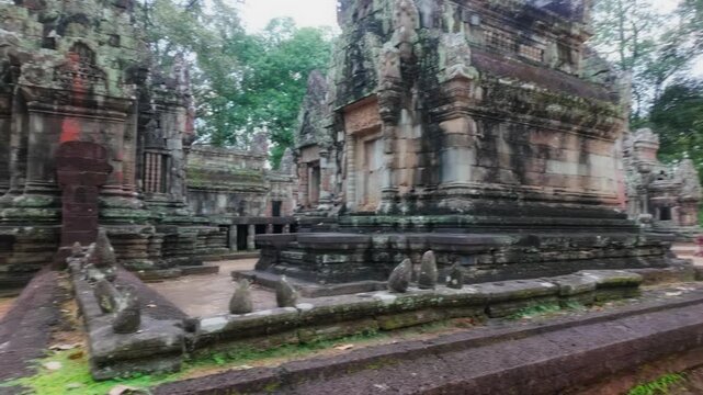 Ancient stone ruins of Thommanon Temple, Siem Reap, Cambodia. The intricate carvings and weathered stone showcase the historical significance of this Khmer Empire architectural marvel.