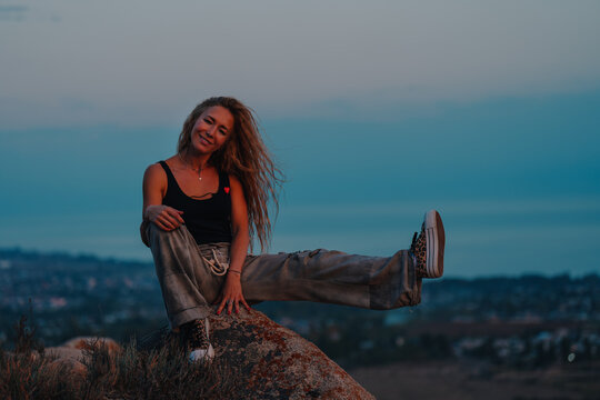 Cheerful woman outdoors portrait in the evening