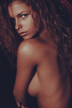 Beauty portrait of a redhead woman with freckles