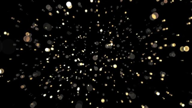 Grand golden particles exploding and flying towards viewer in deep space background