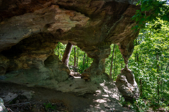 View of the unique sandstone rock formations and lush green forest at Pickle Springs Natural Area New Offenburg, Missouri, United States.