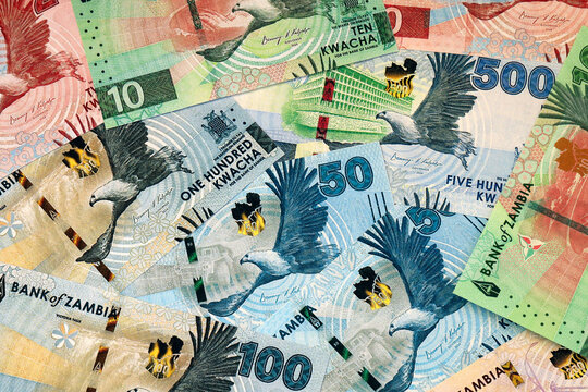 Zambian kwacha money bills in pile on table. Zambia ZMW currency cash close up