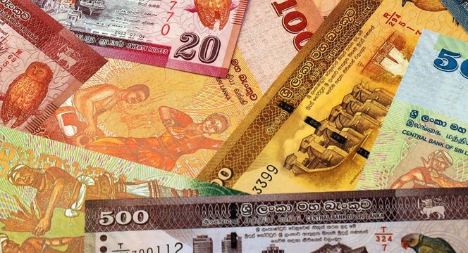 Sri Lankan rupee money bills in pile on table. Sri Lanka LKR currency cash close up