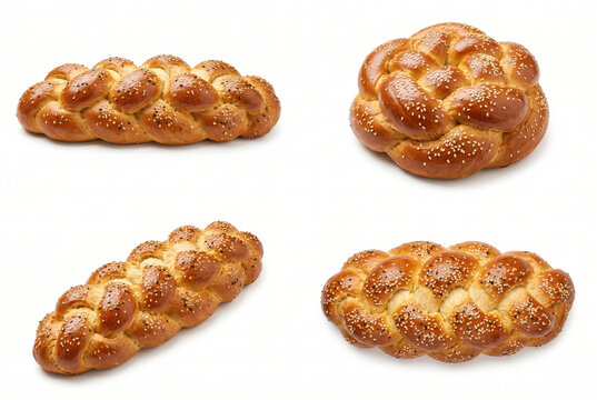Four braided challah bread loaves isolated on white background
