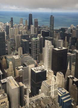 Chicago, United States - 15 September 2025: View of the dense urban skyline with skyscrapers and Lake Michigan under an overcast sky.