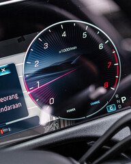 Naklejka premium Close Up View of Car Tachometer and Dashboard in Motion.