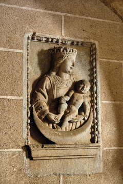 Plasencia, Spain - 03 December 2025: View of the stone relief of the Virgin Mary and Child on a wall inside the Catedral Nueva de Plasencia.