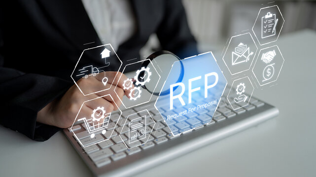 Business professional analyzing RFP process with digital icons representing project management, finance, and technology on a keyboard. Bitwise.