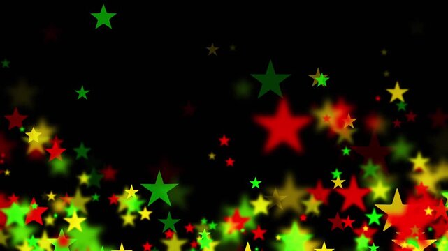 Stars floating upward in bold red, yellow, and green colors on black background for Juneteenth, or Freedom Day, to commemorate the ending of slavery on June 19th 1865 in the United States of America.