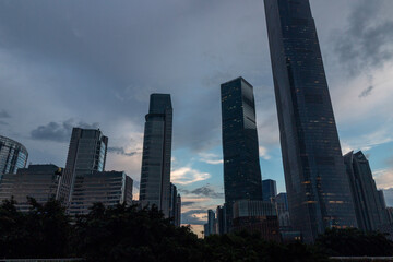 Naklejka premium modern buildings in guangzhou at sunset