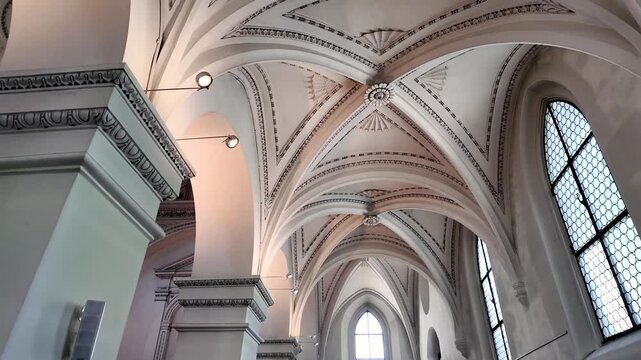 Ornate gothic revival vaulted ceiling of a historic church interior in Zurich, Switzerland.