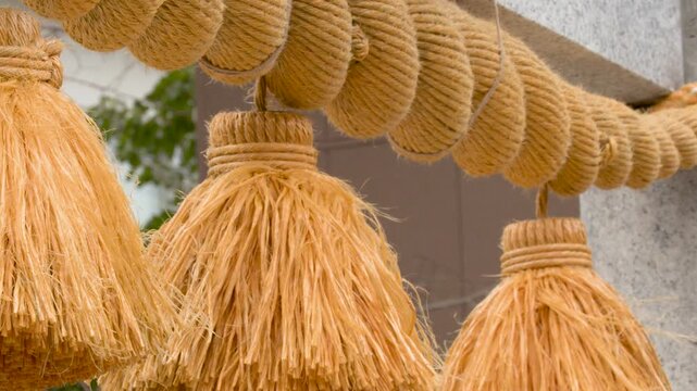 Traditional Shinto Shimenawa Sacred Rope with Tassels at a Japanese Shrine