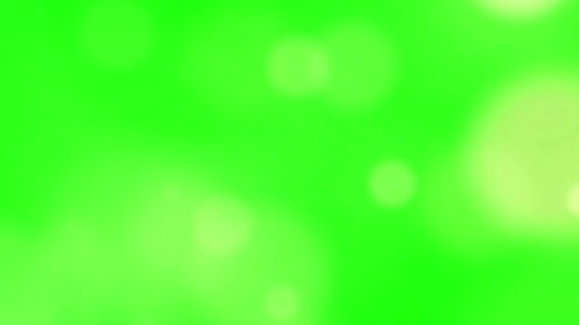 Close up motion of burning paper edge with glowing embers and bright green screen background abstract visual effect dynamic transition footage
