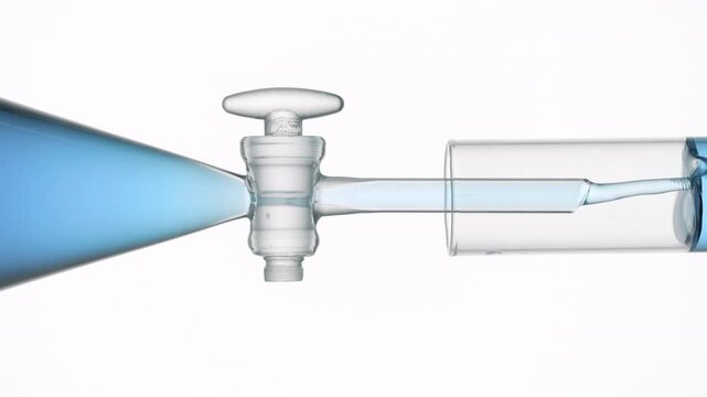 Immense close view of transparent blue liquid flowing from the separatory funnel through the glass stopcock into a test tube, filling it up with a white backdrop | Fragrance cosmetic formulation idea