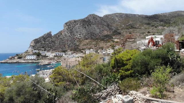 Cinematic Approach to Mediterranean Levanzo Harbor with Ferry in Sicily