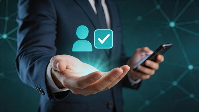Verified user account approval concept with businessman holding smartphone displaying checkmark icon, symbolizing successful login authentication and trusted digital identity